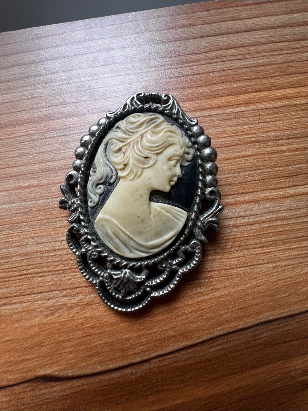 Cameo style costume brooch with ivory and black carving